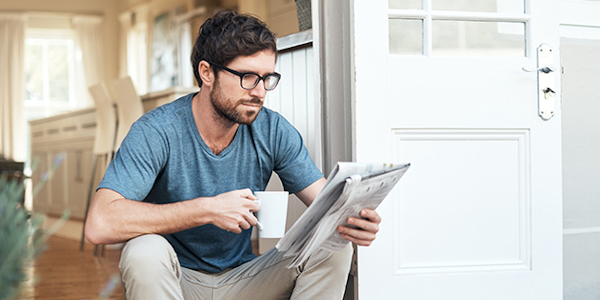 illustratie man leest krant